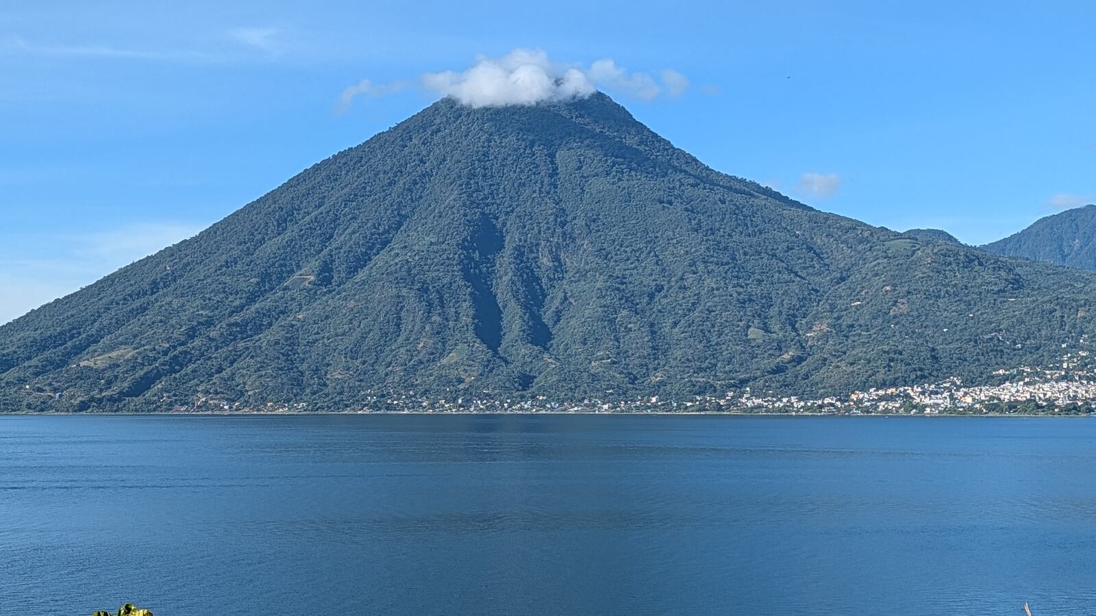 The volcano rising over the lake on a clear day
